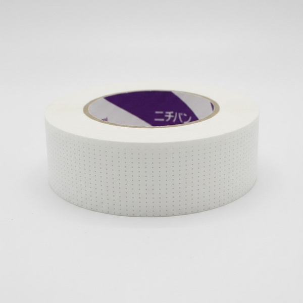 Eyelash tape roll, white dotted backing with purple inner core label