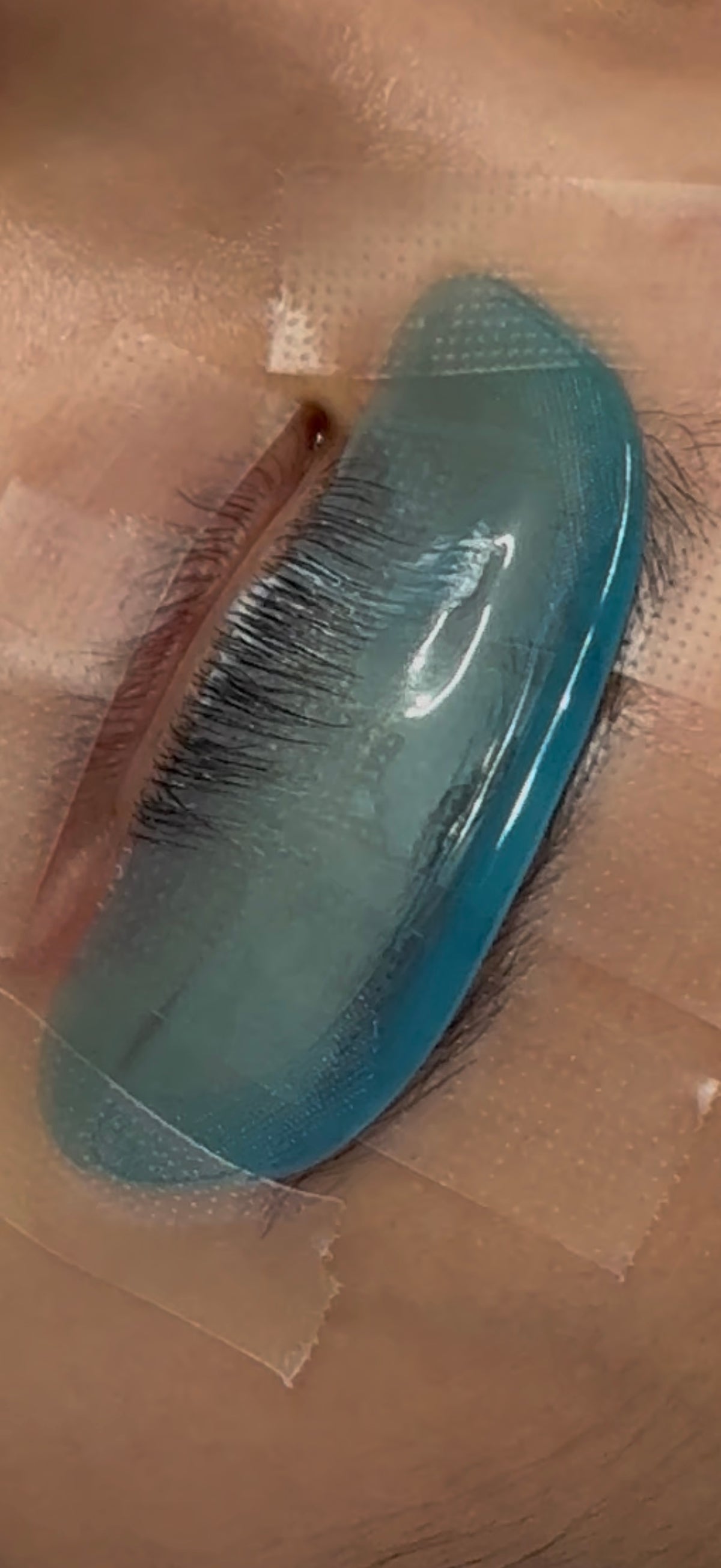 Mochi Softening Pad applied on skin — ships in a randomly selected colour