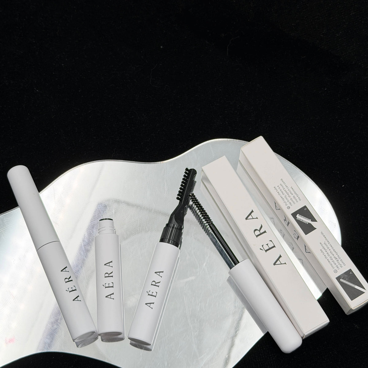 AÉRA dual-end brow gel tube, spoolie applicator, and boxed packaging set