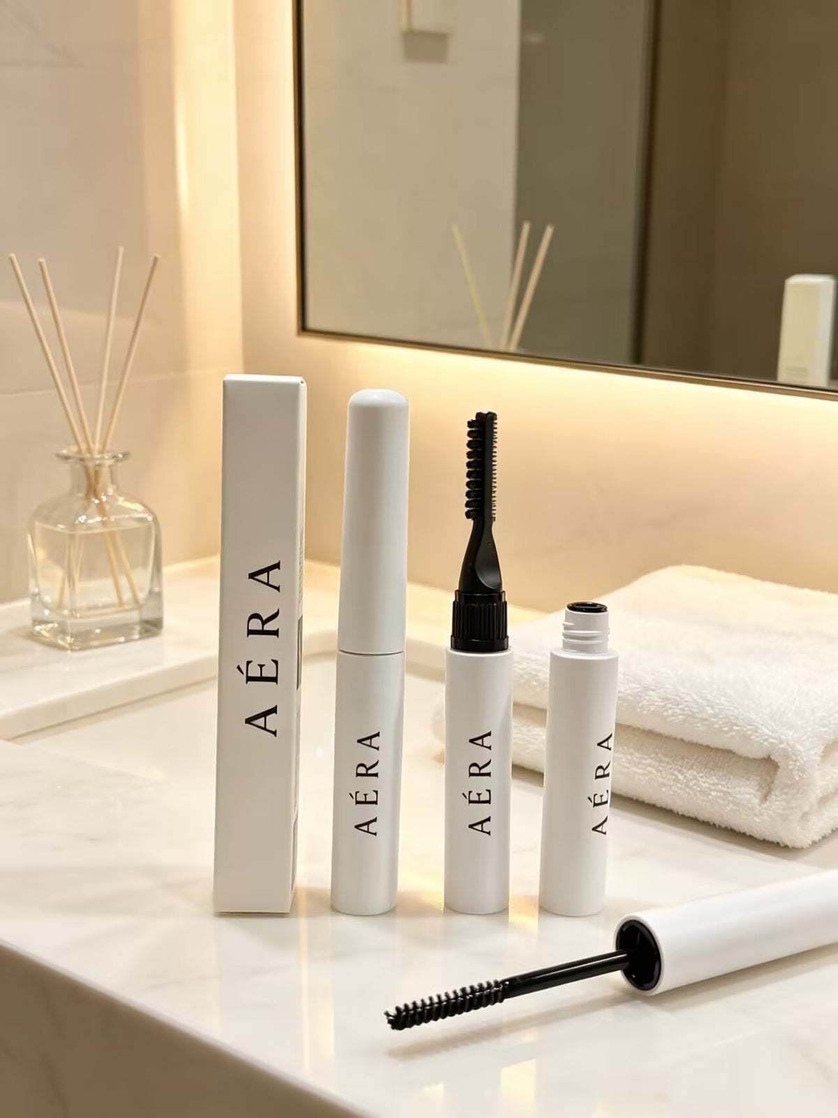AÉRA dual-end brow gel tube with spoolie wand and open cap