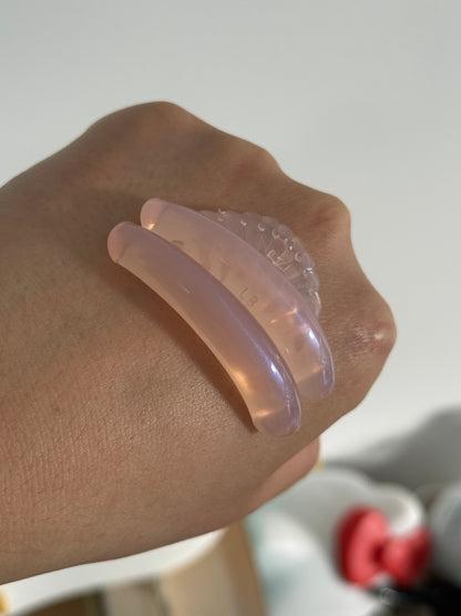 AÉRA Sora Curl silicone pad on hand, ridged curved design for lash shaping