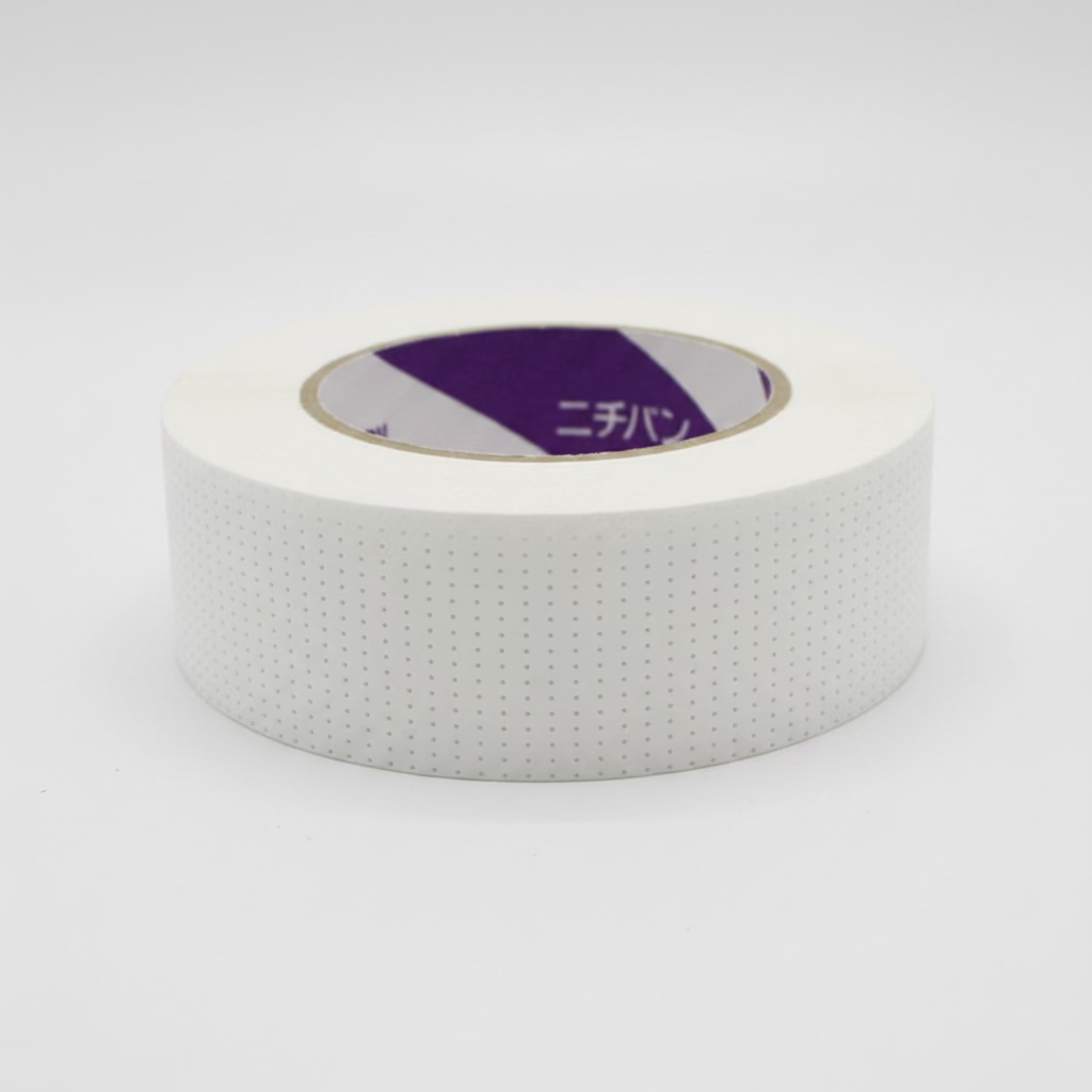 Eyelash tape roll, white dotted backing with purple inner core label