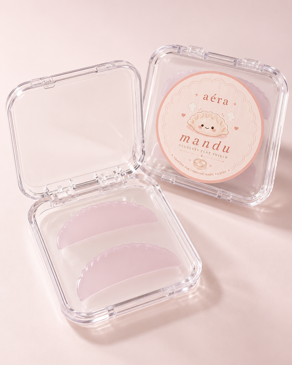 Clear plastic case with two light cream softening pads and an outer label