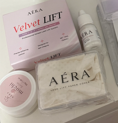 AÉRA Lash Lift Paper Cover shown alongside the Velvet LIFT system, pH Balancing Gel, and Mochi Balm