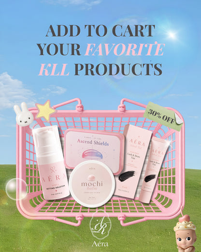 AÉRA K-Lift skincare set with bottle, jar, tubes, box, and bunny charm