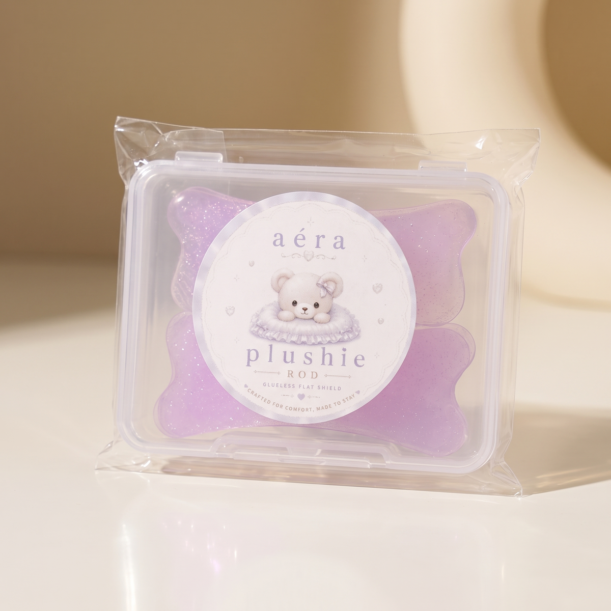 Plushie Flat Softening Pad kit in clear case with purple bear-shaped pads