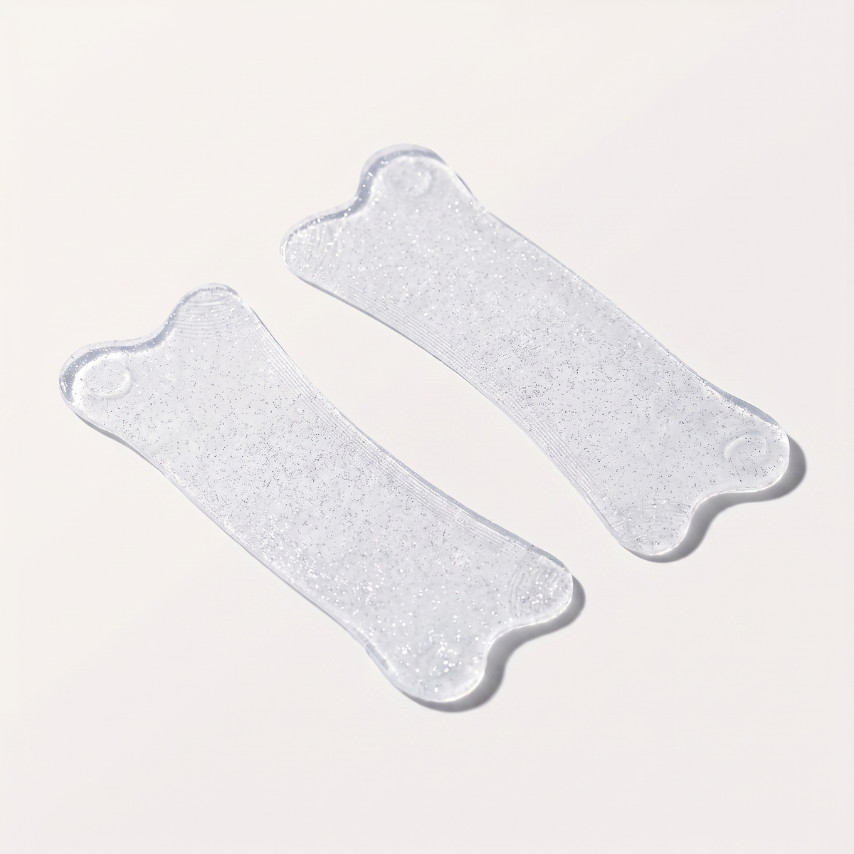 Glitter Plushie Flat Softening Pad pieces, light silver bone-shaped pads
