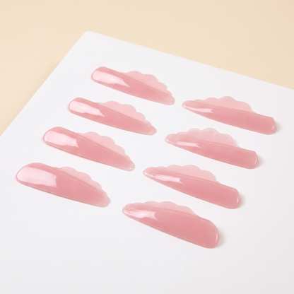 Pink V-curl lash perm rods, several curved rods on a white backing card