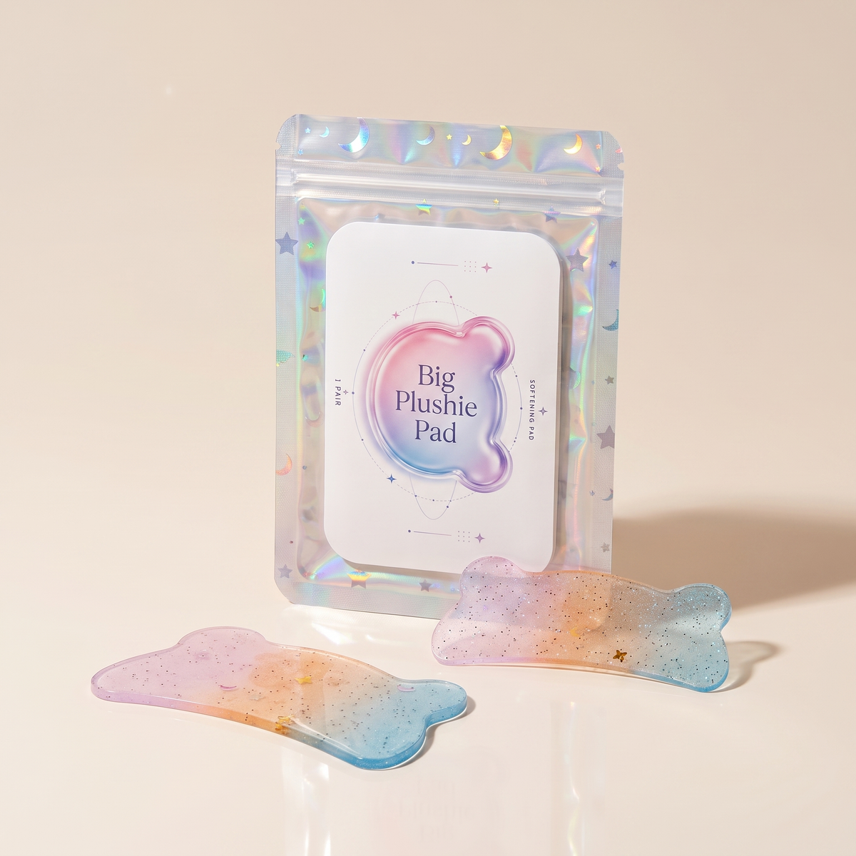 Big Plushie Softening Pad in holographic pouch with two pastel translucent pads