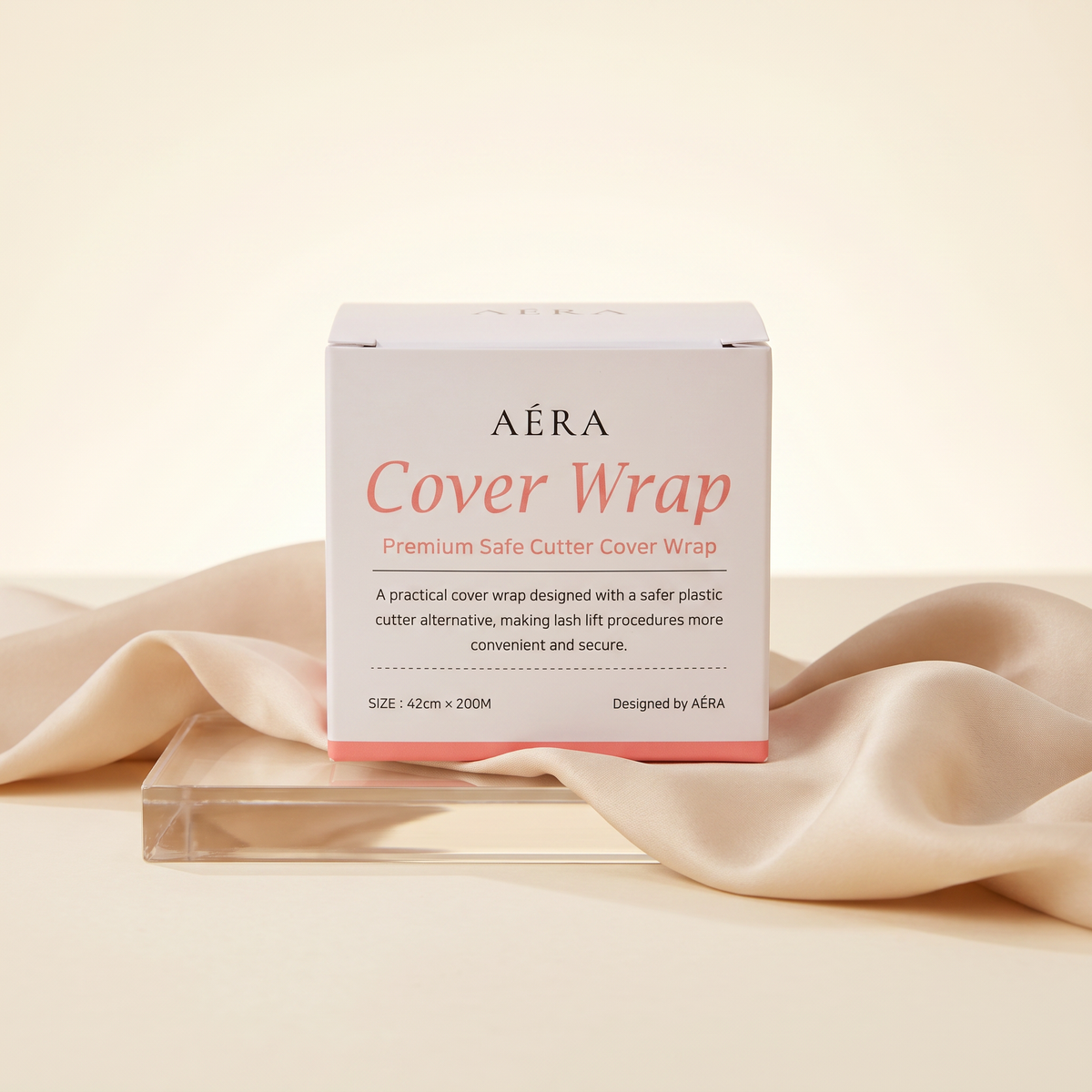Cover wrap box with beige fabric roll visible; white package with pink base