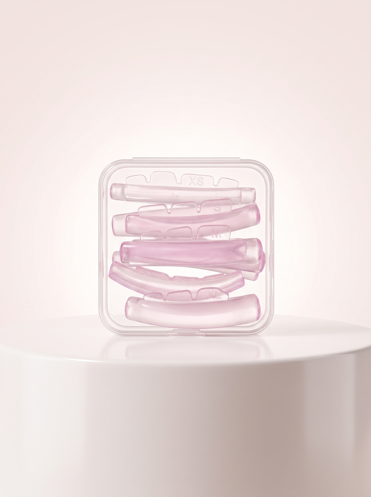 Rose Curl pink silicone perm pads in clear case, size XS marked