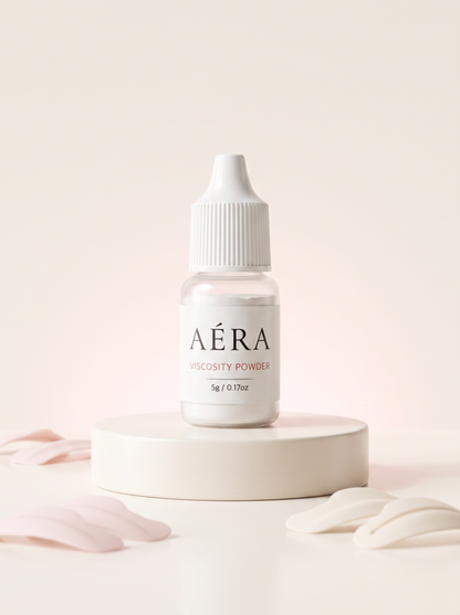 AÉRA Viscosity Control Powder bottle, white cap and clear bottle